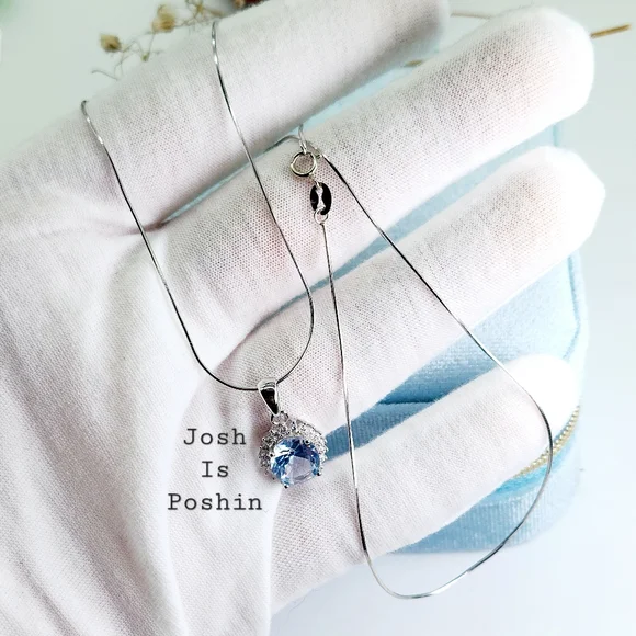 Oval blue topaz pendant necklace in sterling silver